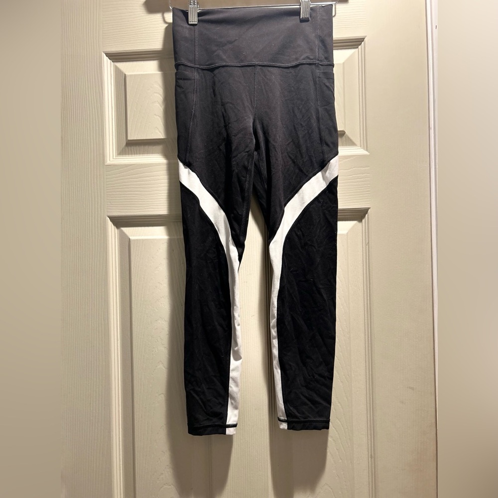 Athleta Salutation Stash 7/8 Black Leggings with White Stripes